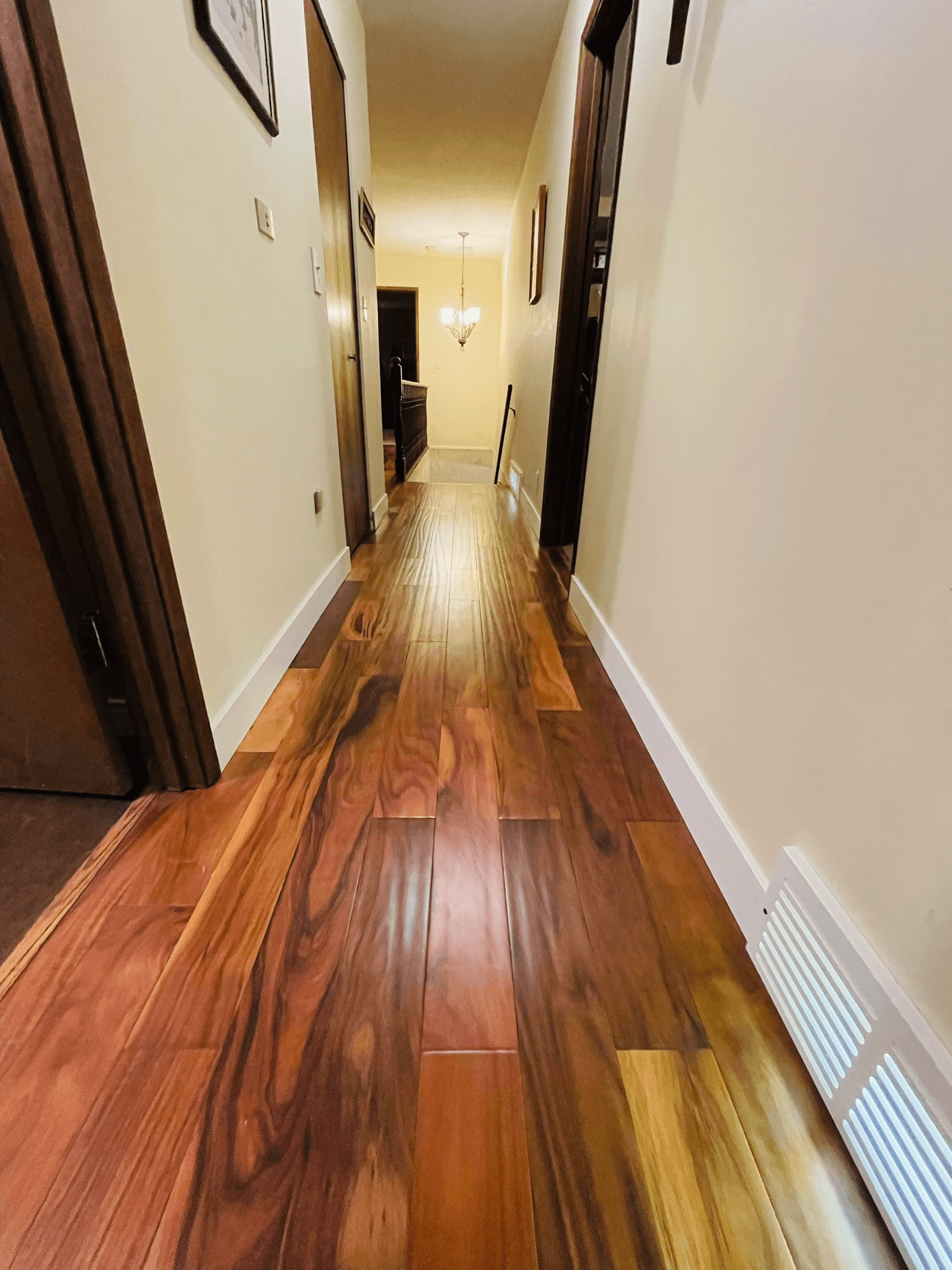 Acacia hardwood flooring installed through an upstairs hallway