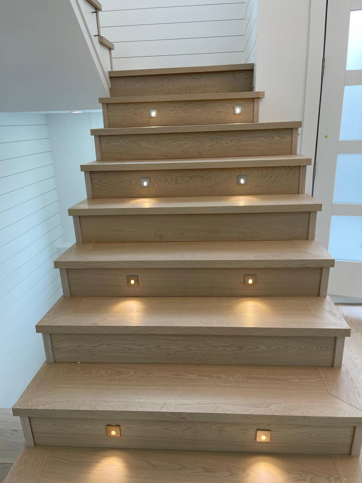 Engineered hardwood stairs installed in a Surrey home
