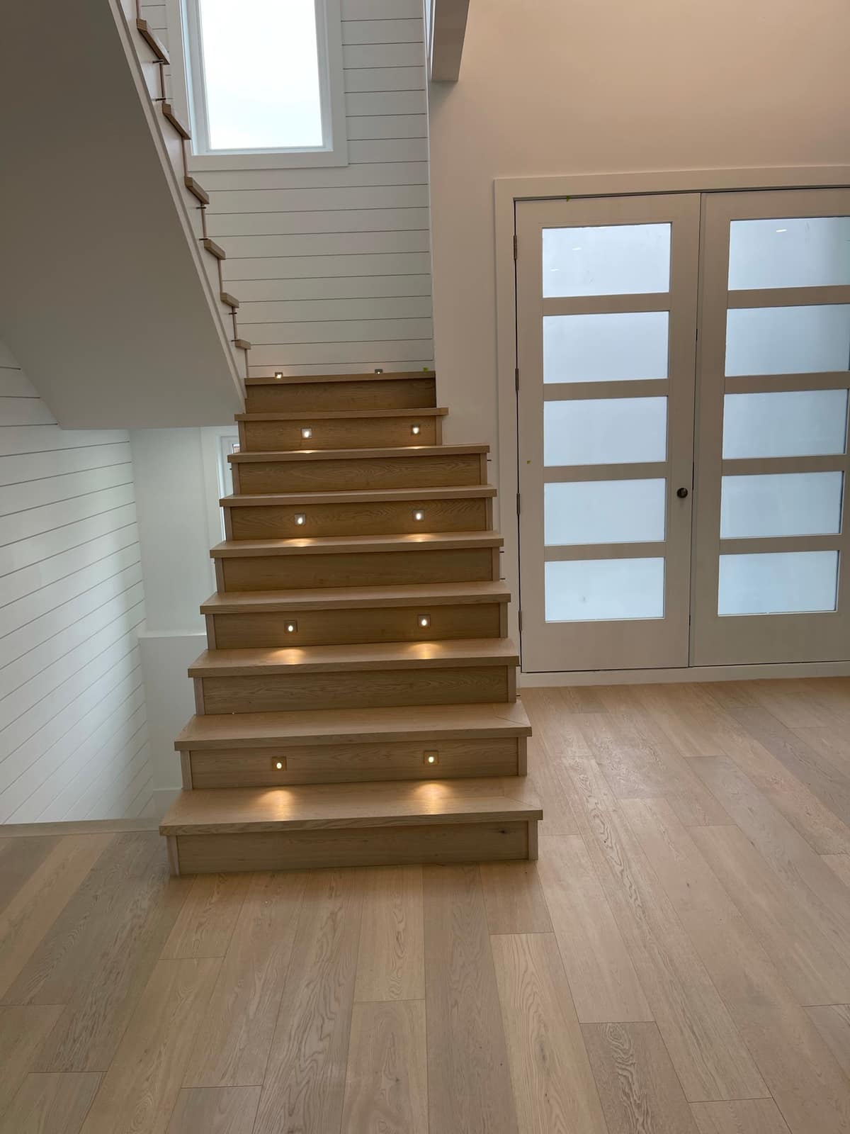 Engineered hardwood stairs installed in a Surrey home