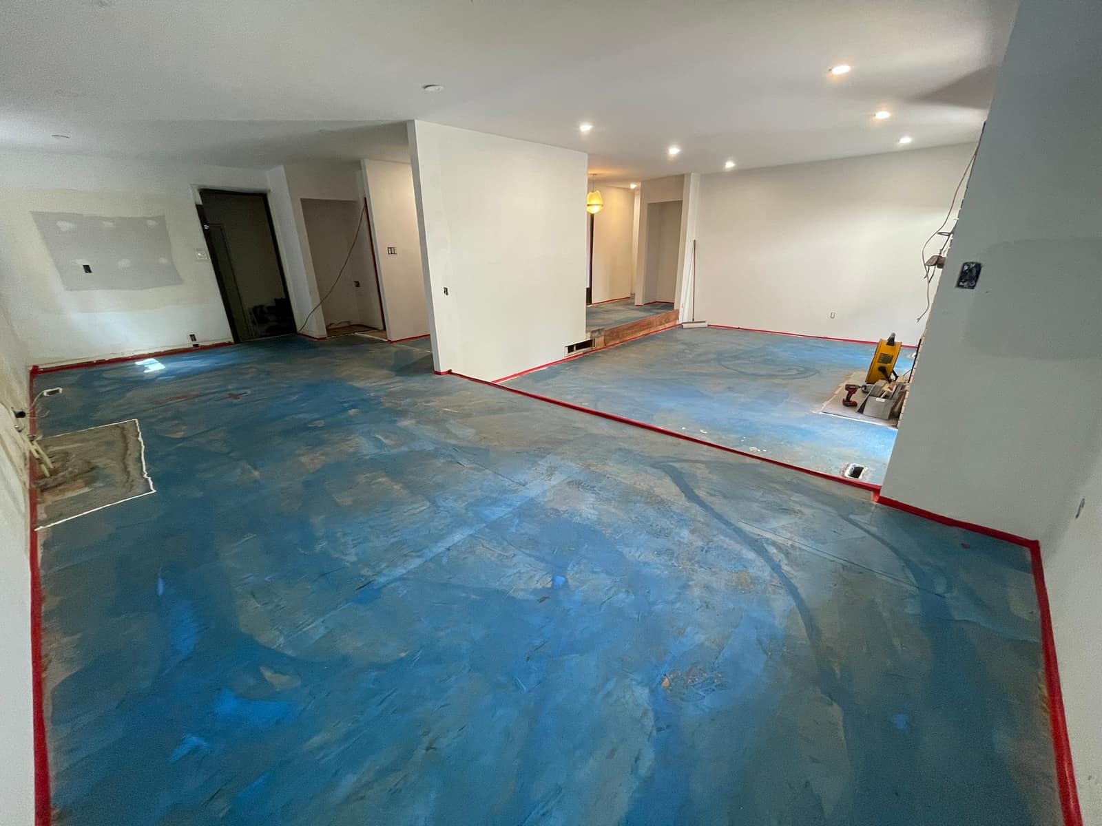Self-levelling underlayment poured in a Delta home