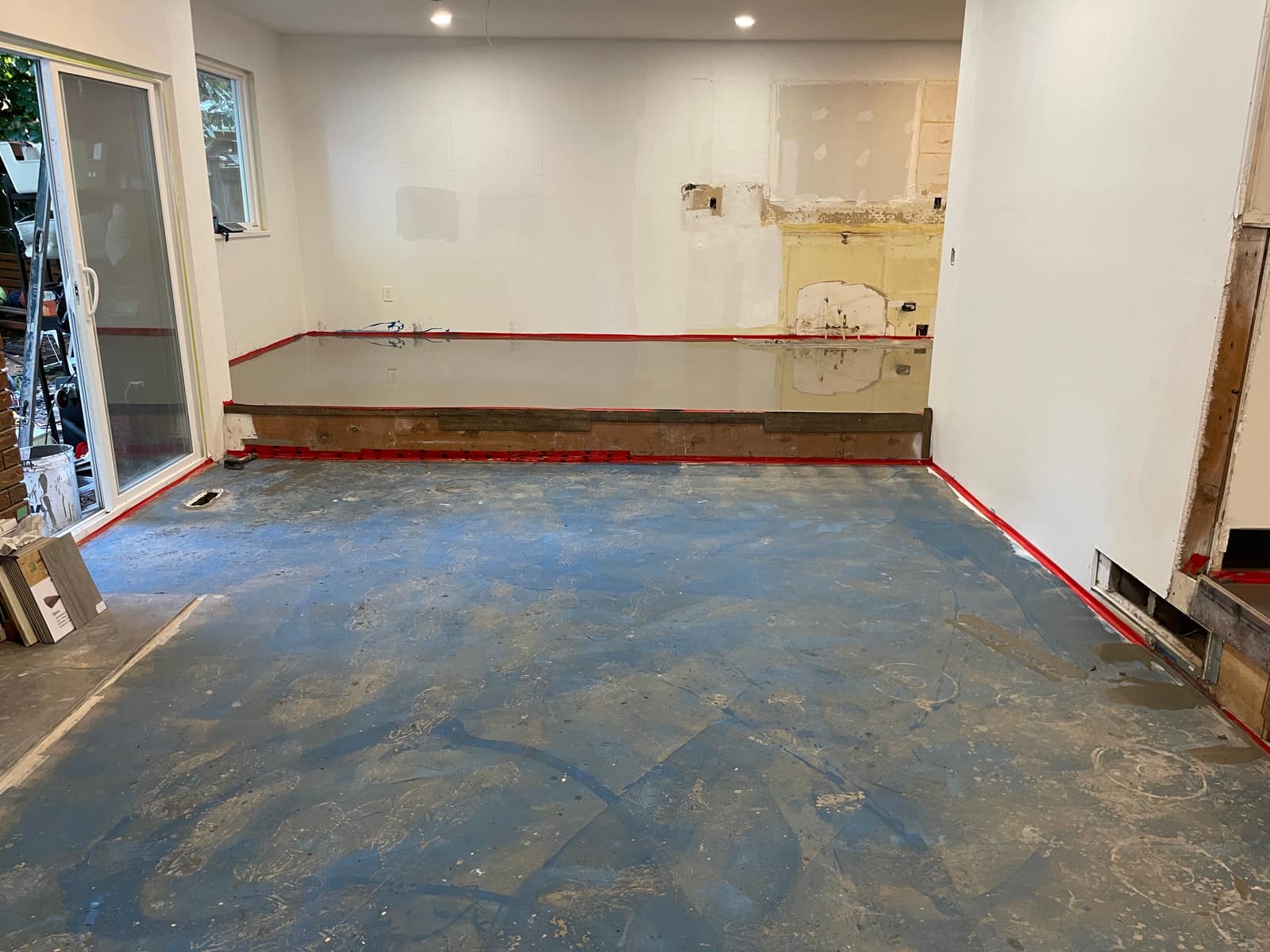 Self-levelling underlayment poured in a Delta home
