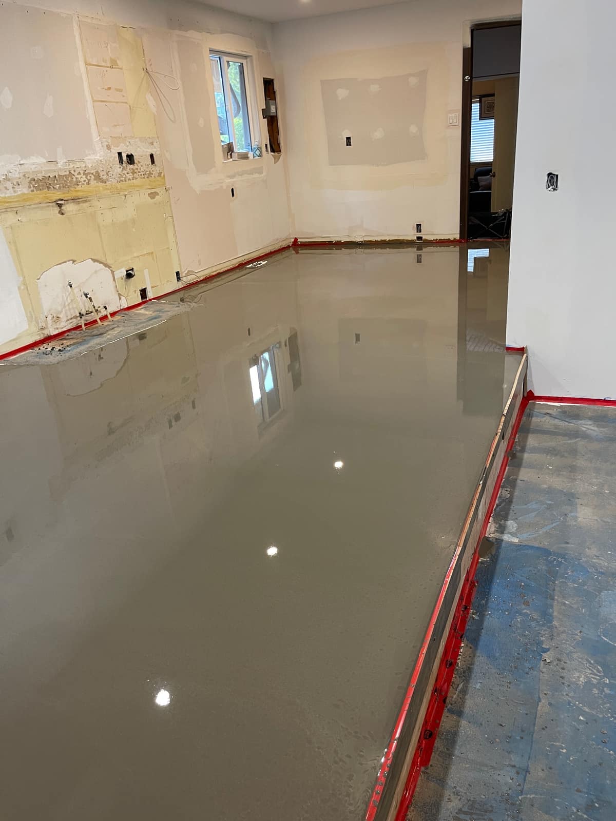 Self-levelling underlayment poured in a Delta home