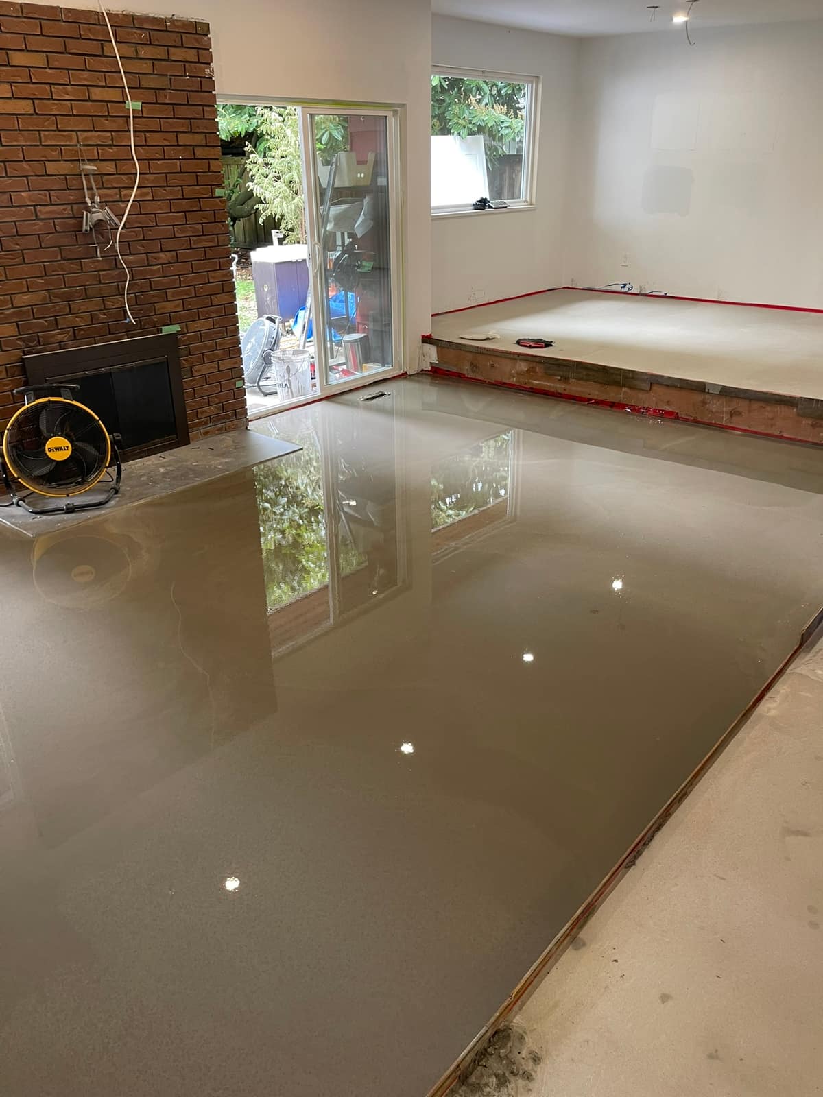 Self-levelling underlayment poured in a Delta home
