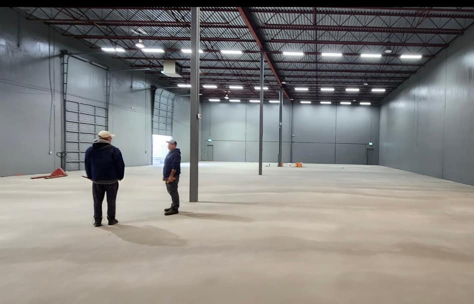 Self-levelling underlayment poured across a Richmond warehouse floor