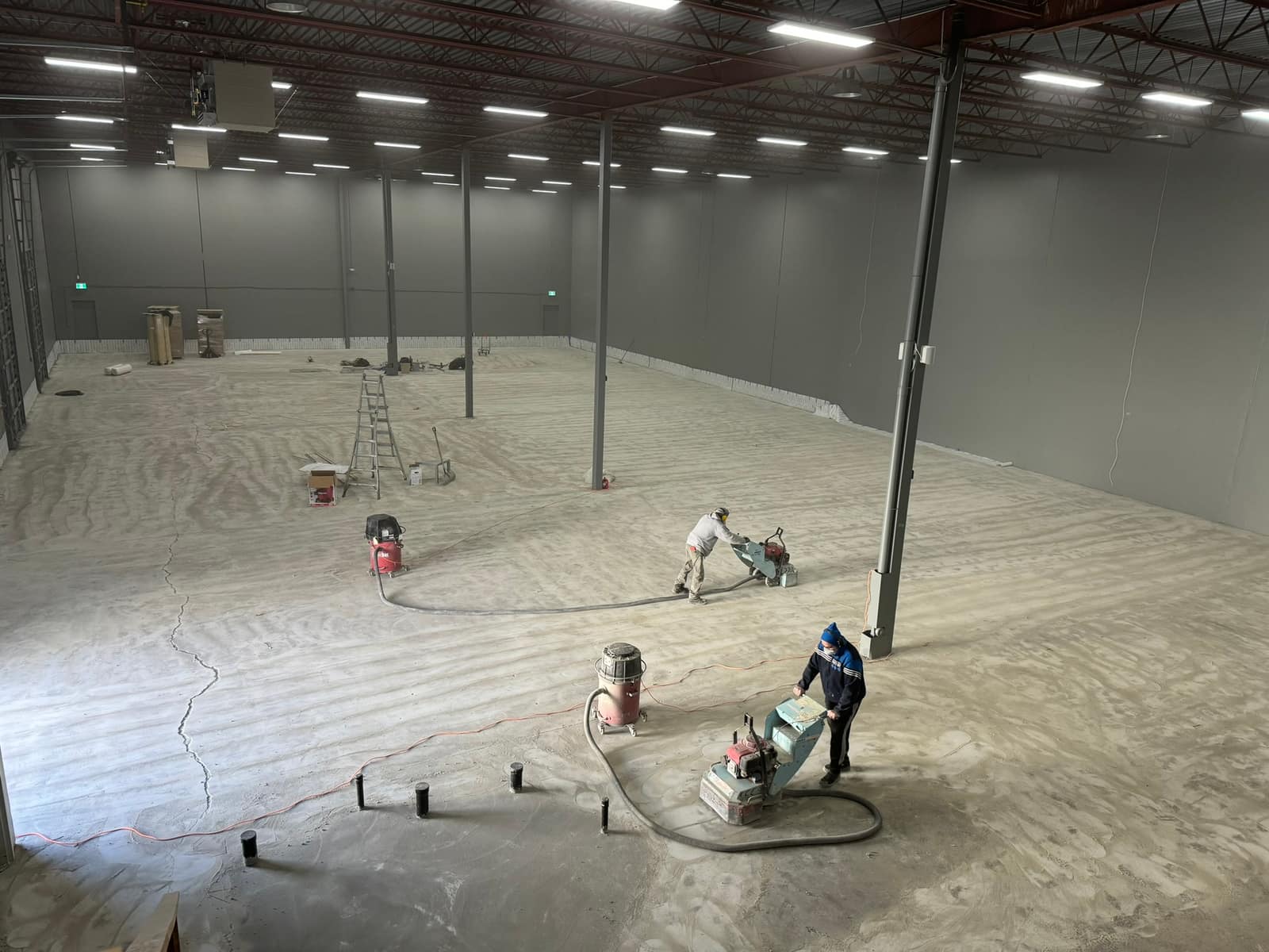 Self-levelling underlayment poured across a Richmond warehouse floor
