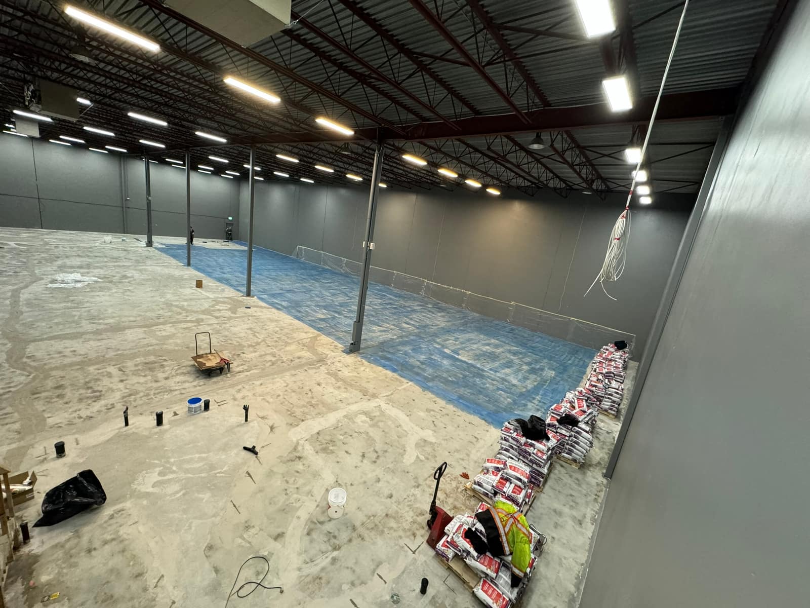 Self-levelling underlayment poured across a Richmond warehouse floor