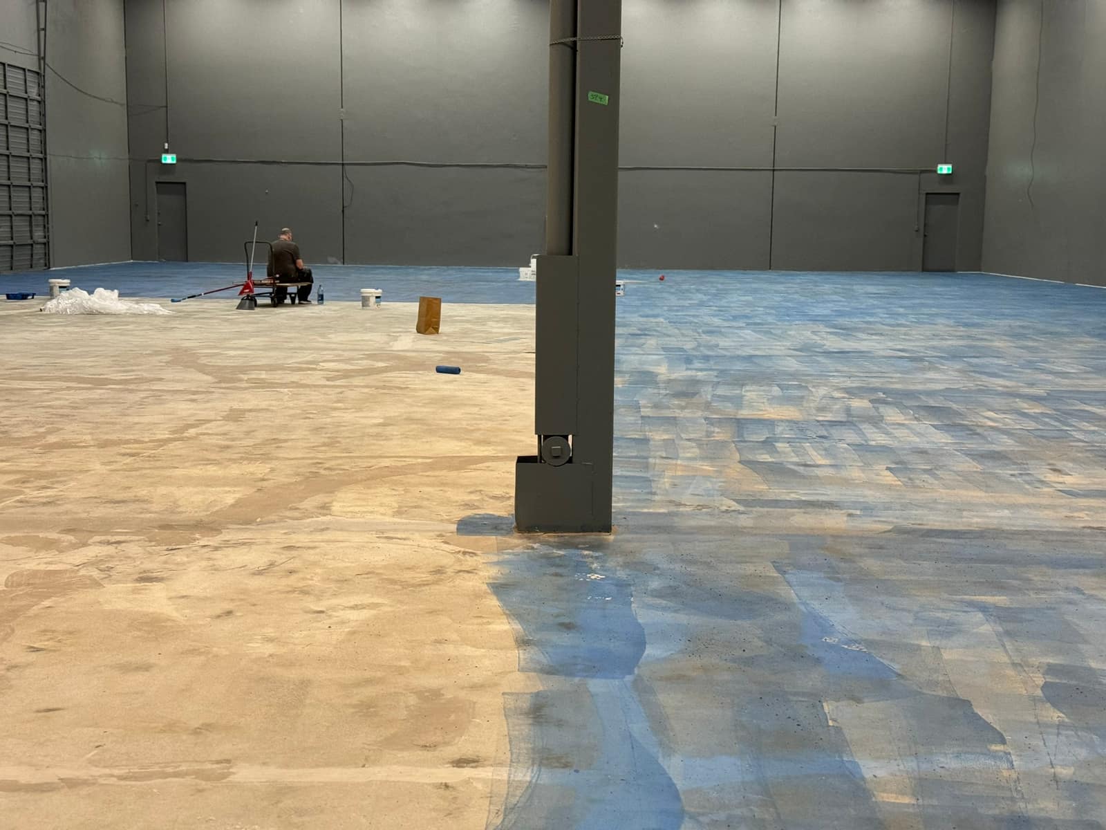 Self-levelling underlayment poured across a Richmond warehouse floor