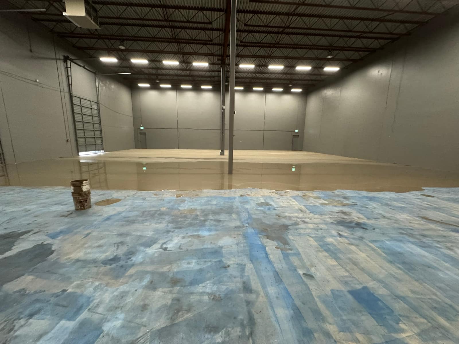 Self-levelling underlayment poured across a Richmond warehouse floor