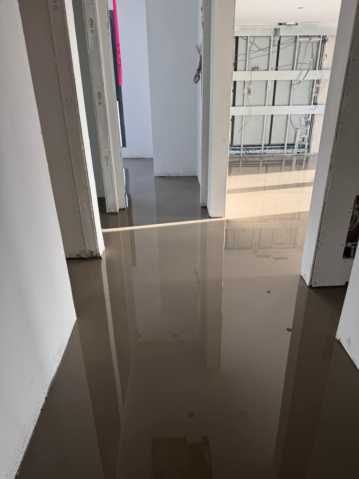 Self-levelling underlayment poured near Broadway and Alma in Vancouver