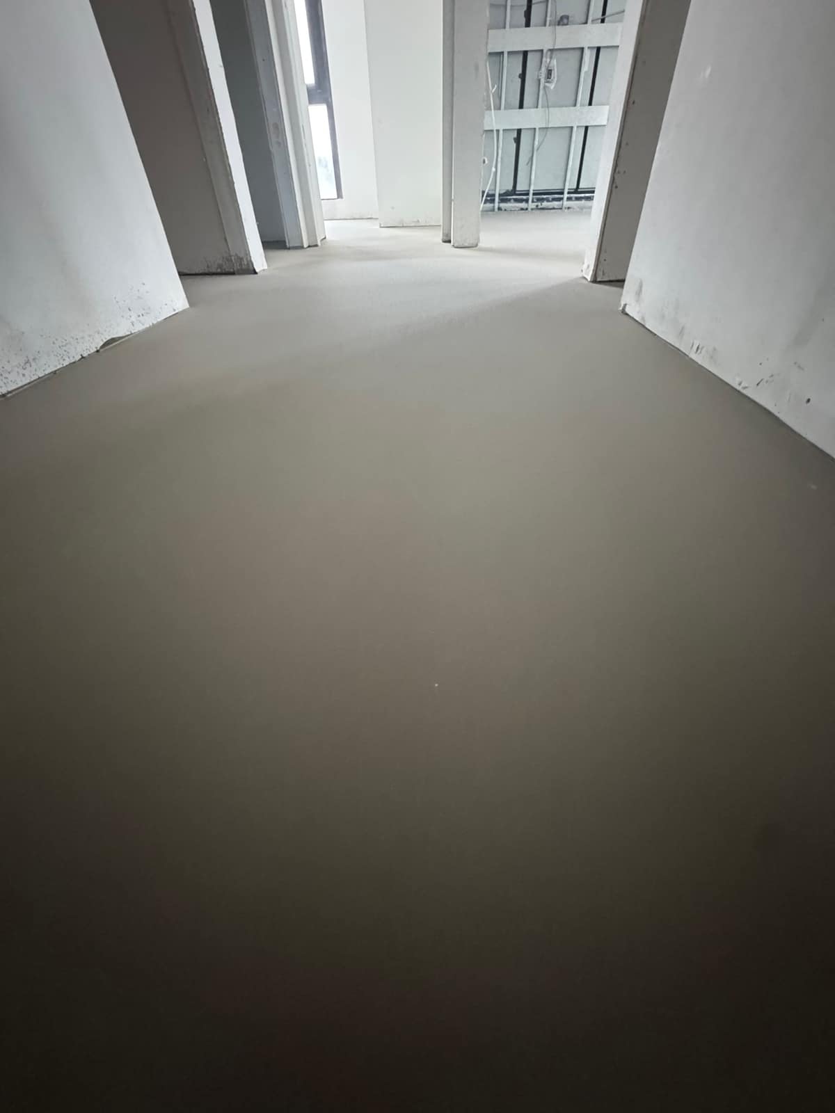 Self-levelling underlayment poured near Broadway and Alma in Vancouver