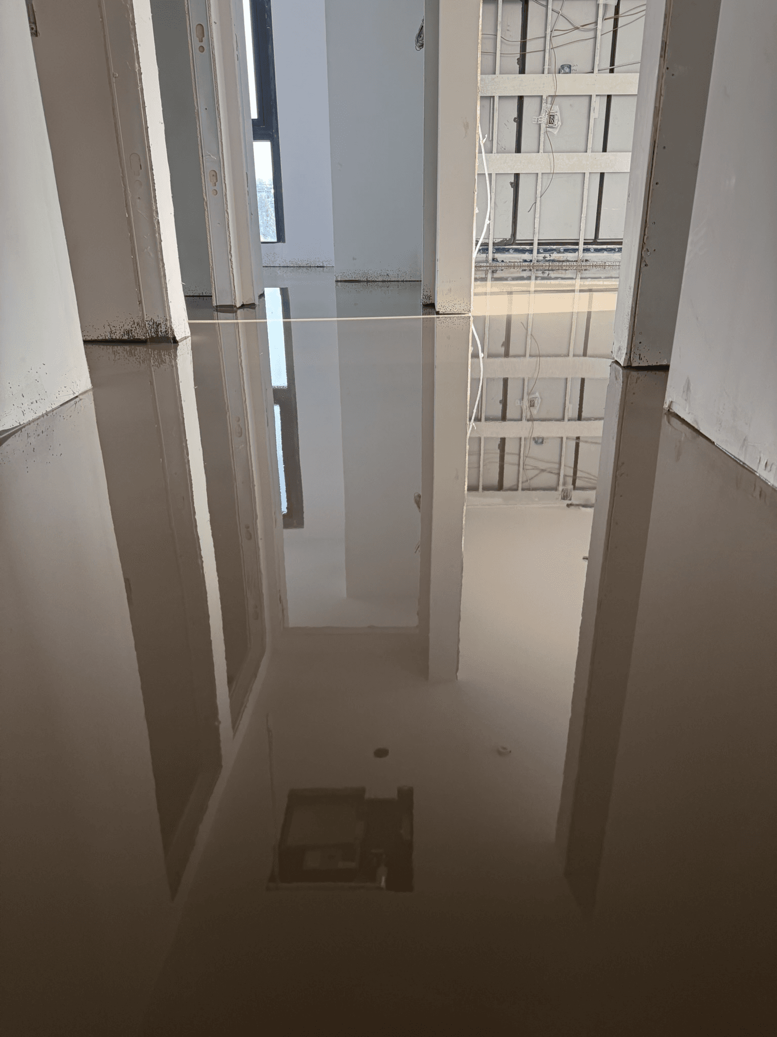 Self-levelling underlayment poured near Broadway and Alma in Vancouver
