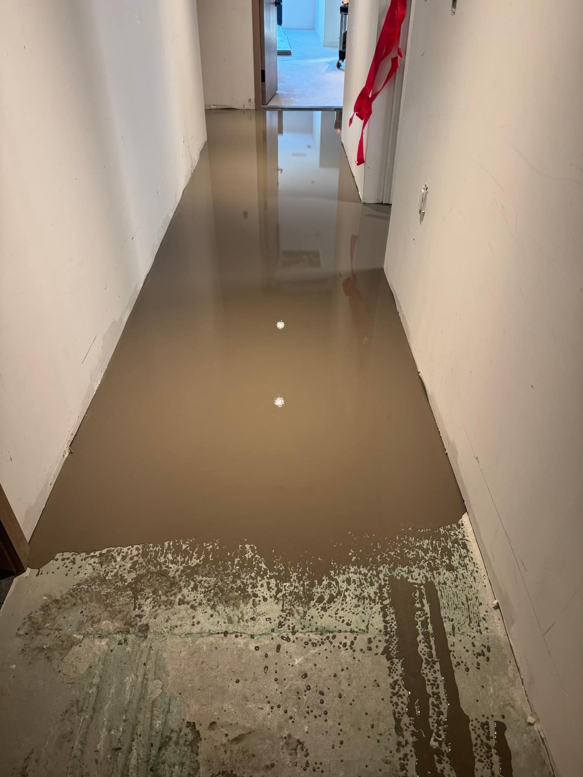 Self-levelling underlayment in a building corridor in Vancouver