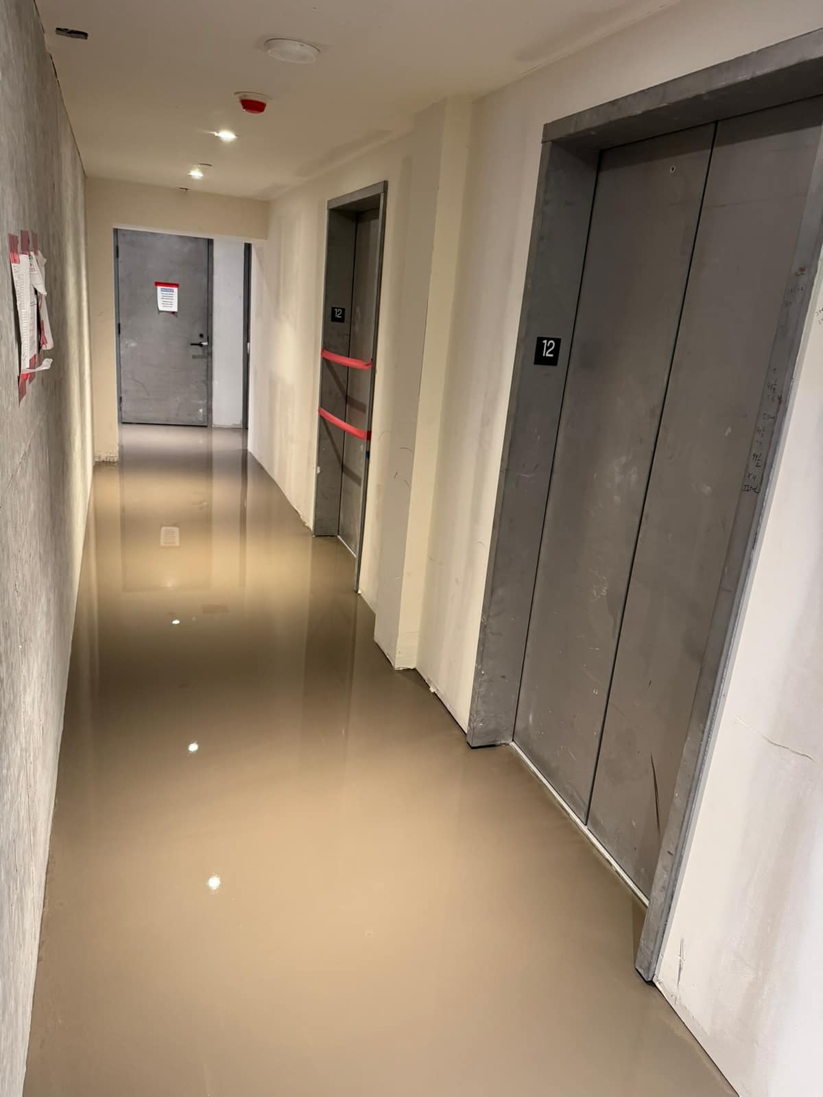 Self-levelling underlayment in a building corridor in Vancouver