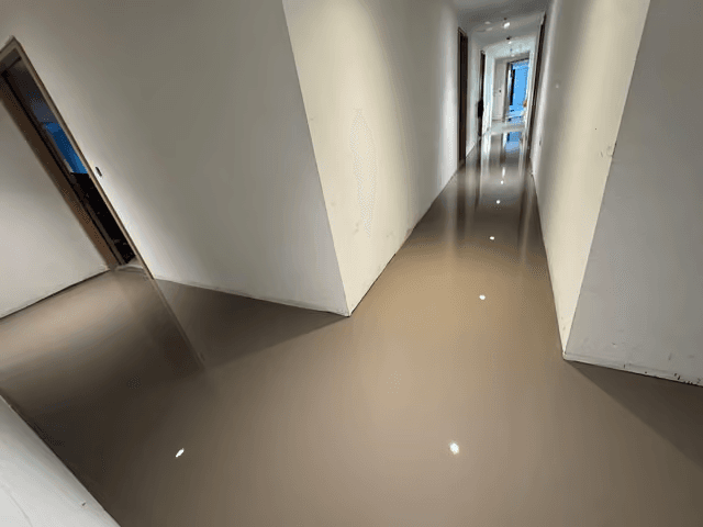 Self-levelling underlayment in a building corridor in Vancouver