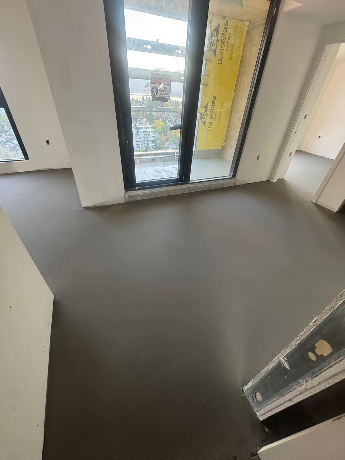 Self-levelling underlayment pour in the Oakridge area of Vancouver