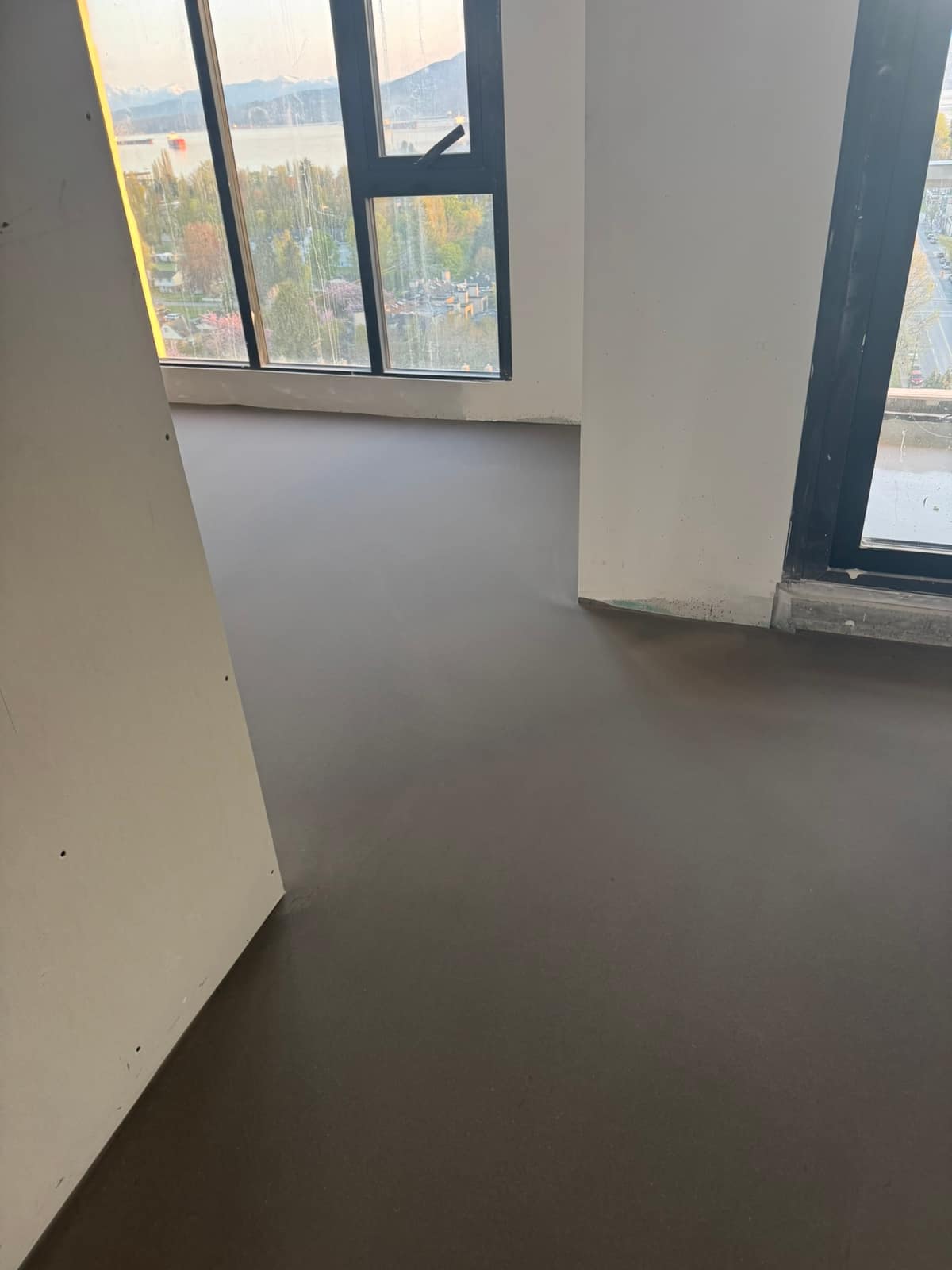 Self-levelling underlayment pour in the Oakridge area of Vancouver