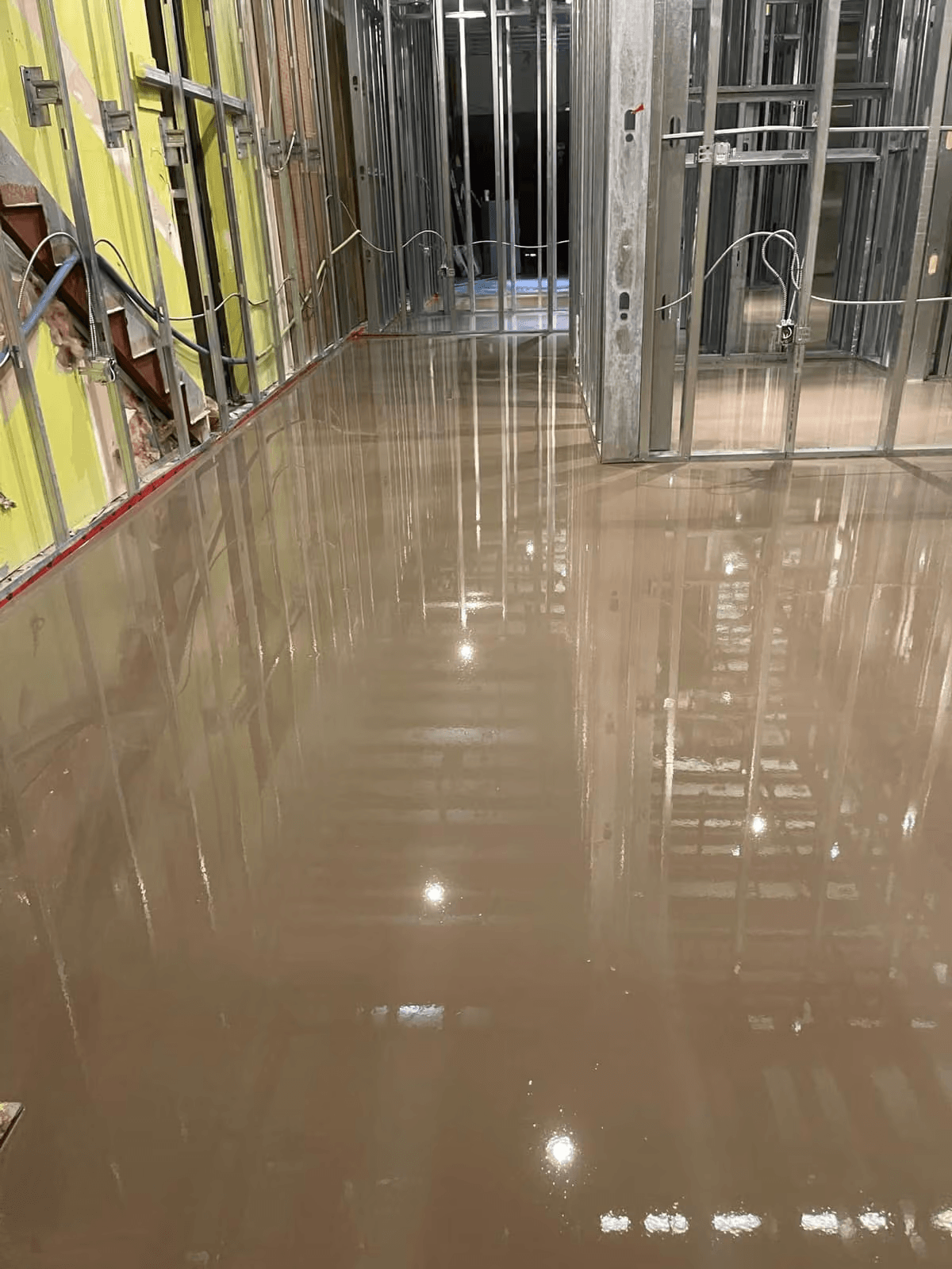 Self-levelling underlayment across a Brentwood showroom floor in Burnaby