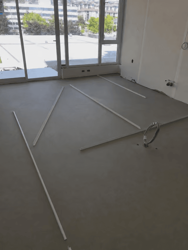 Self-levelling underlayment pour at a Metrotown high-rise in Burnaby